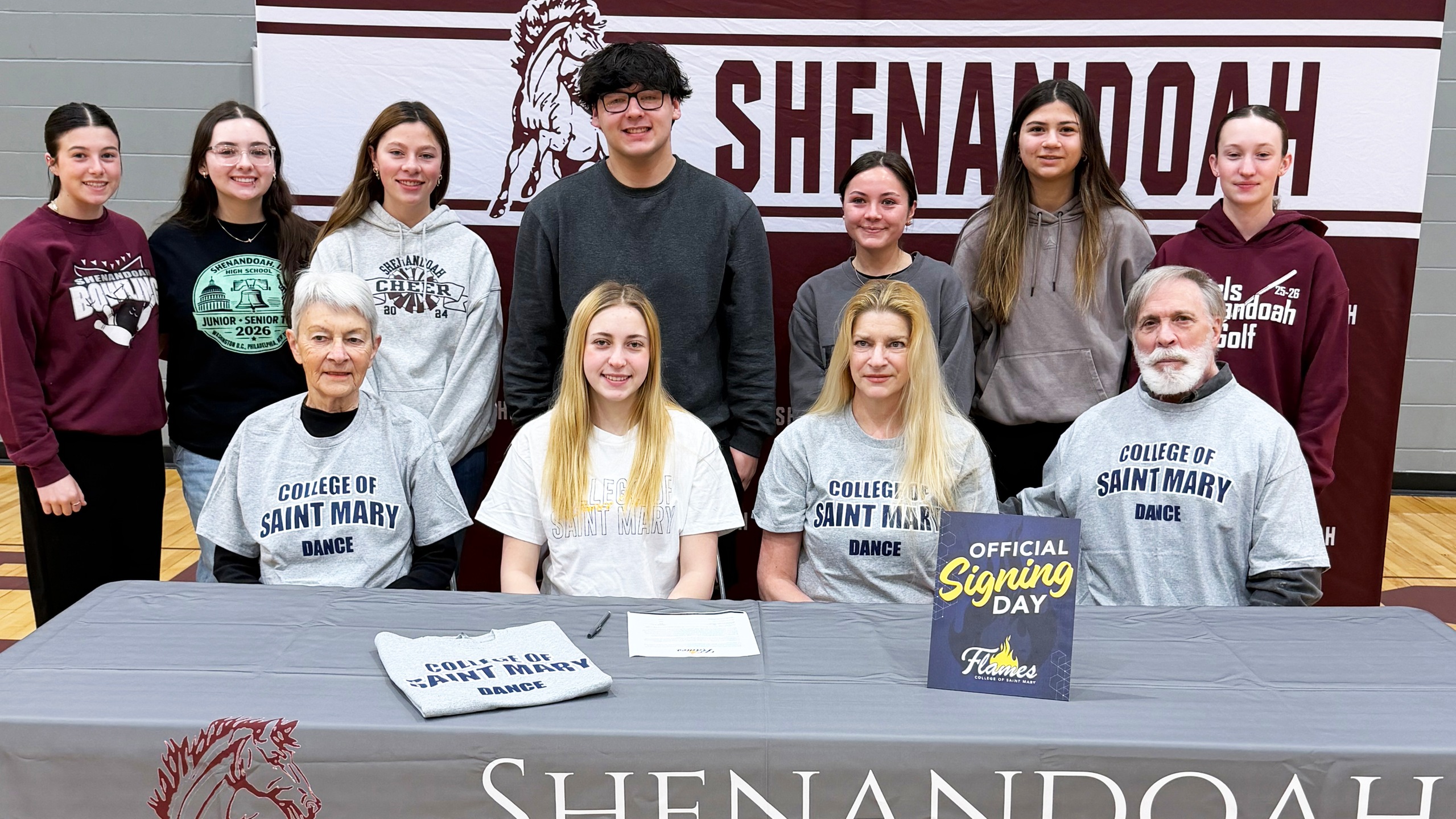 Green signs with CSM competitive dance program